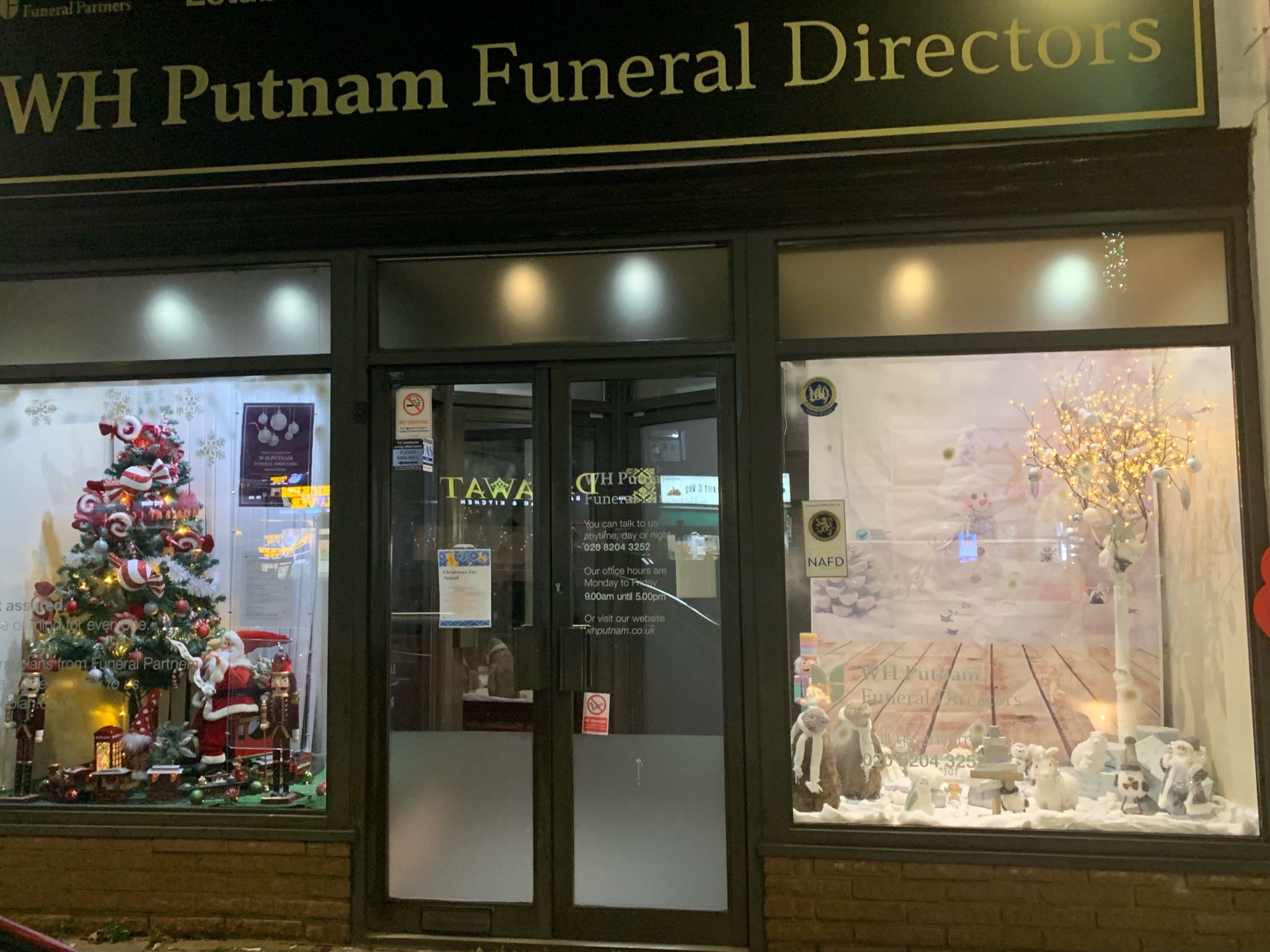Festive window WH Putnam Funeral Directors